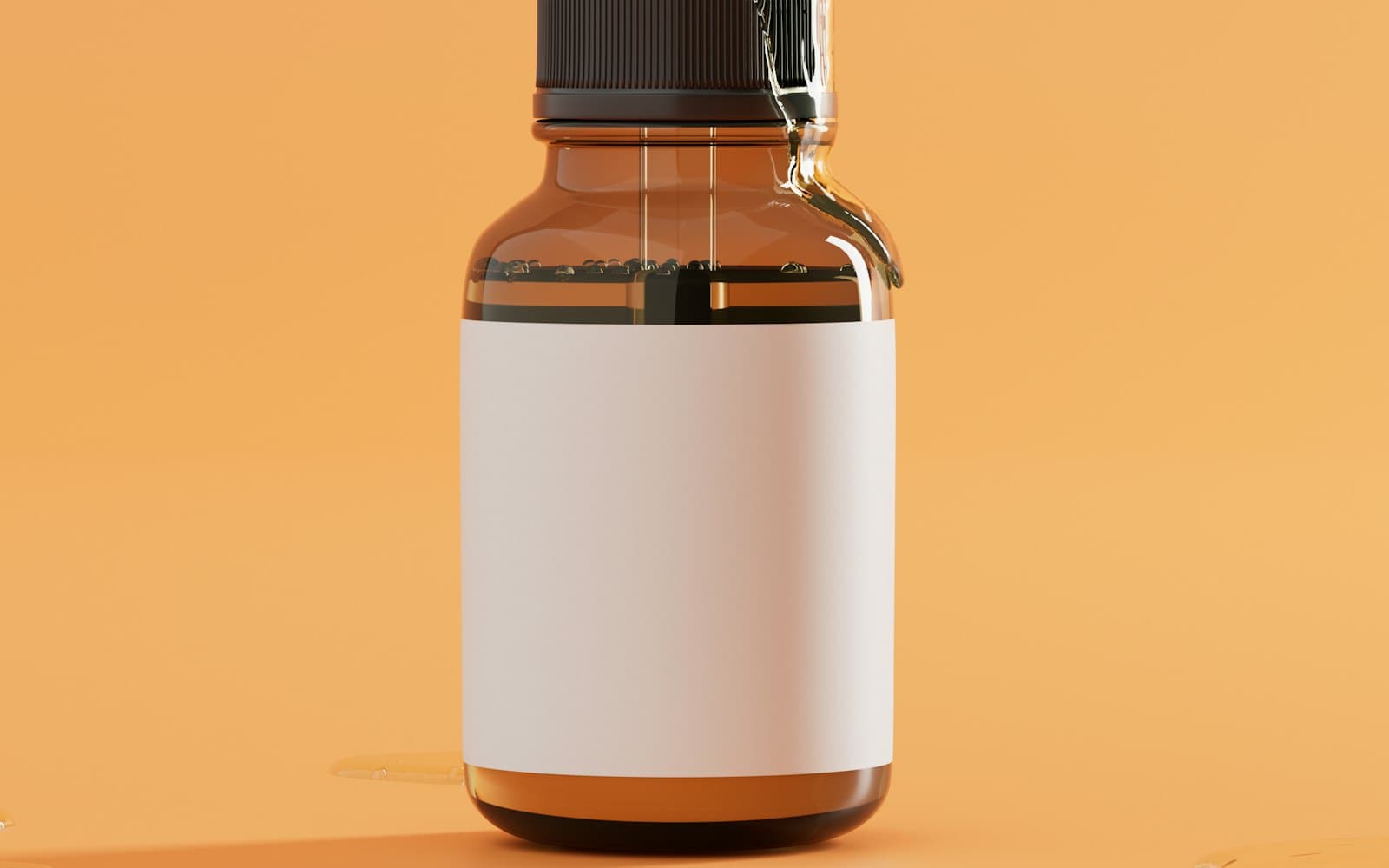 Amber serum bottle with a blank label on a warm orange backdrop